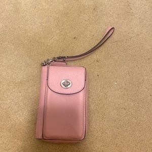 Coach wristlet wallet in the color baby pink
